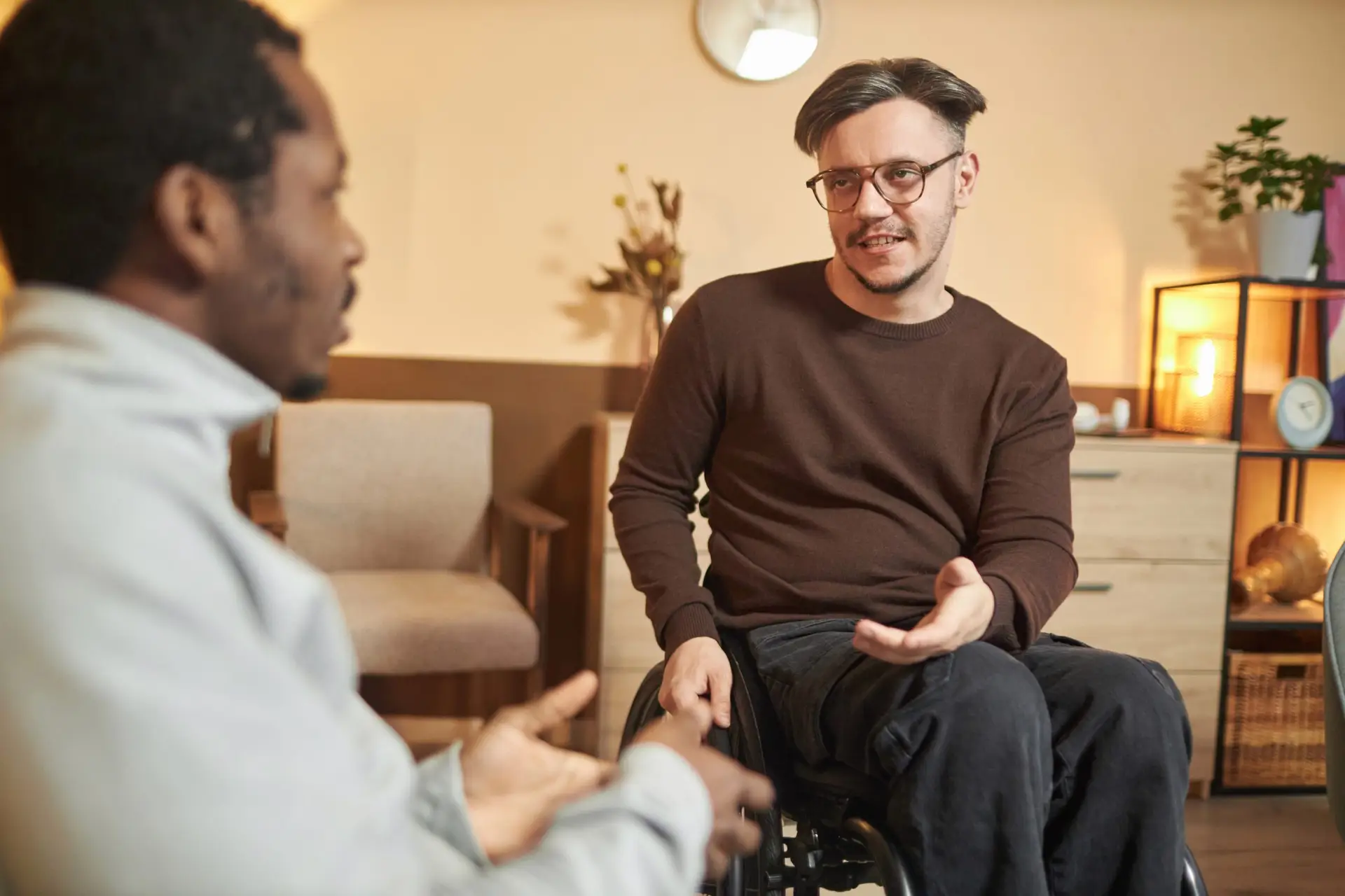 two men sitting talking coaching