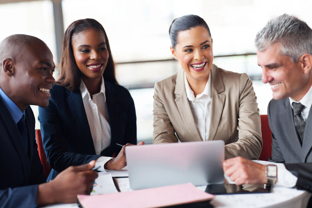 people in business meeting at a table