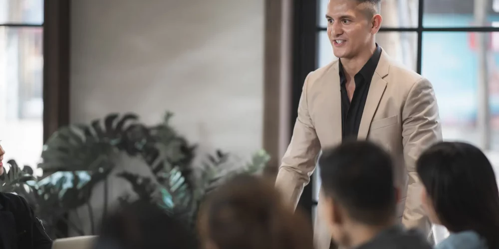 CEO giving a presentation on mental health in leadership